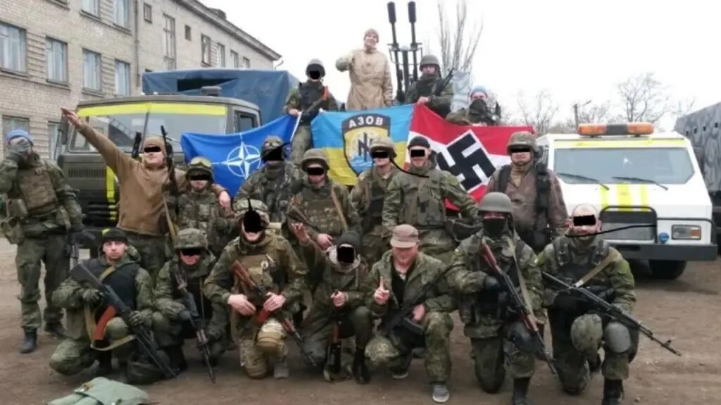 Azov Battalion fighters with NATO flag at left and Nazi flag at right